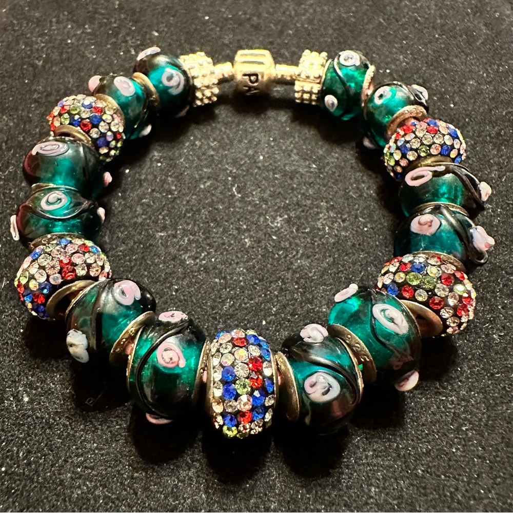 Glass Beads on the leather braided pink bracelet silver clasp says Pandora